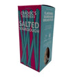 A vibrant pink and teal cardboard box of cradocs delisticks salted sourdough breadsticks with crumb texture and baker tom ciabatta style individually wrapped inside
