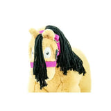 A plush yellow toy pony with black dreadlock mane and pink harness from crafty ponies headcollars toy collection
