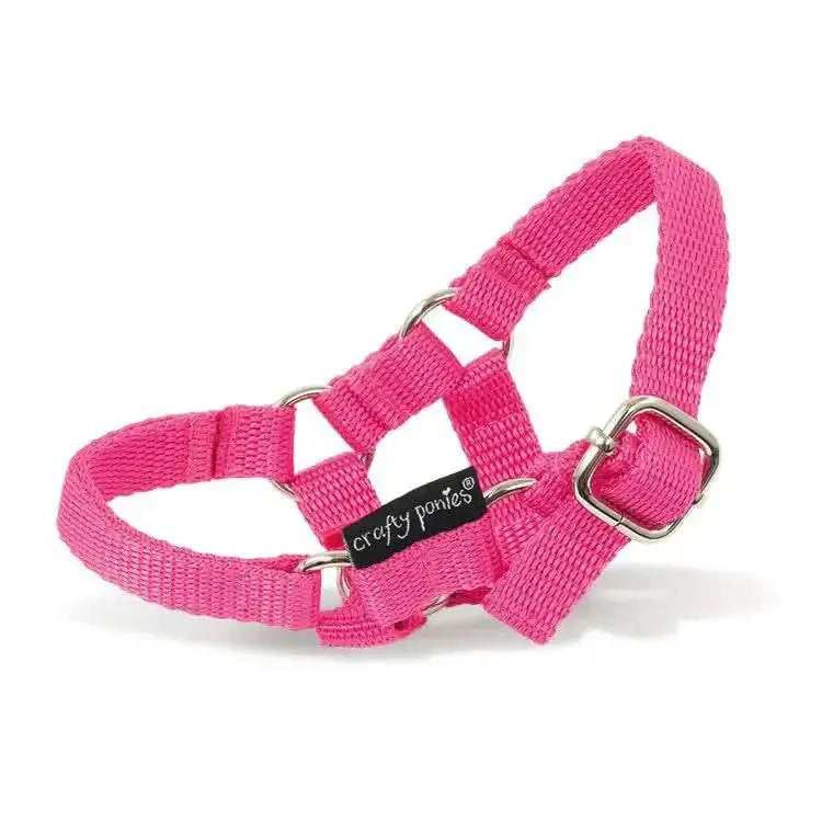 Bright pink woven nylon halter harness with silver hardware and crafty ponies headcollars brand tag for toy pony headcollars