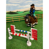 Brown plush toy pony with striped hooves wearing saddle and bridle ridden by doll in crafty ponies jumping set