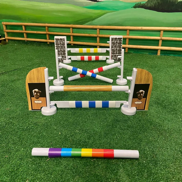 Colorful crafty ponies jumping set with plastic bars wooden panel ends and stone-textured side posts toy pony obstacle
