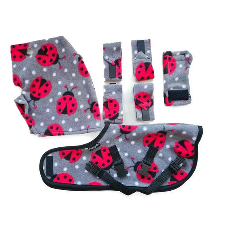 Gray fleece ladybug patterned baby carrier with black straps from crafty ponies snuggle rug set