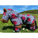 Gray fleece crafty ponies snuggle rug with red ladybug and white polka dot pattern and black adjustable straps
