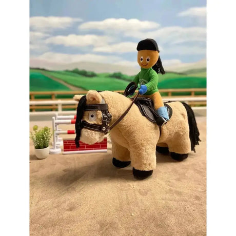 Plush crafty ponies toy pony exmoor with tan fur black mane saddle and small rider in green outfit soft toy ponies