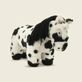 A crafty ponies soft toy pony piebald with black and white spots and a fluffy mane made of soft textured fur