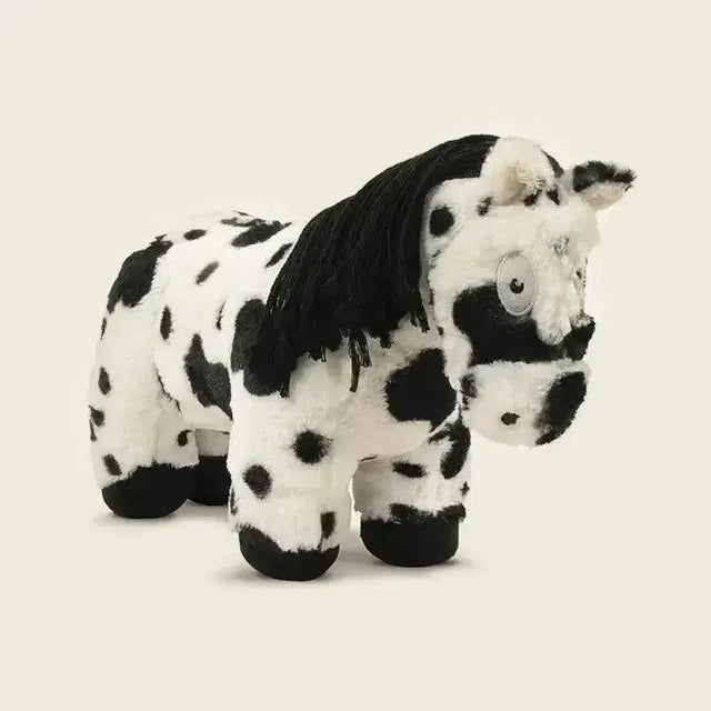 A crafty ponies soft toy pony piebald with black and white spots and a fluffy mane made of soft textured fur
