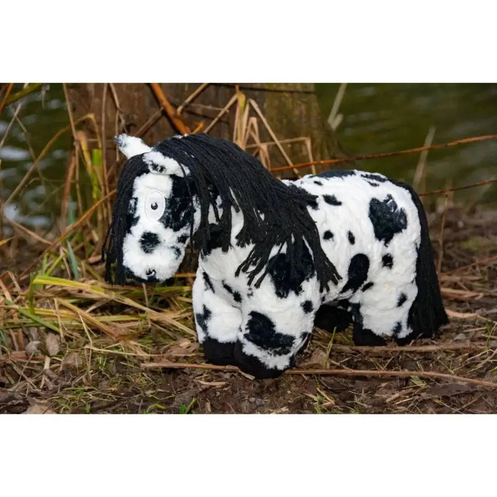 A crafty ponies soft toy pony piebald with plush black and white spots and a long textured mane