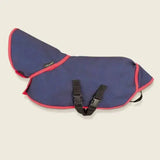Navy blue crafty ponies turnout rug with pink trim and black adjustable straps for ponies turnout use