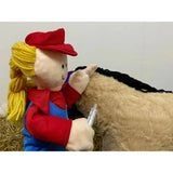 A plush toy farmer verity vet with yellow yarn pigtails red cap and overalls holding a syringe from crafty ponies stable