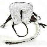 White sheepskin-lined horse saddle pad with dark brown leather straps and silver stirrup leathers in crafty ponies western tack starter set
