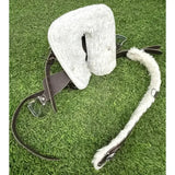 White sheepskin saddle pad with black leather straps and metal buckles from crafty ponies western tack starter set