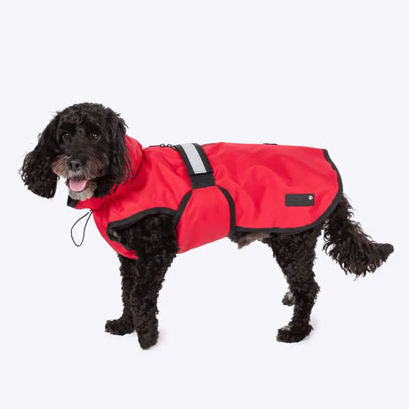 Red waterproof dog coat with black trim and reflective strip featuring danish design velcro straps and funnel neck