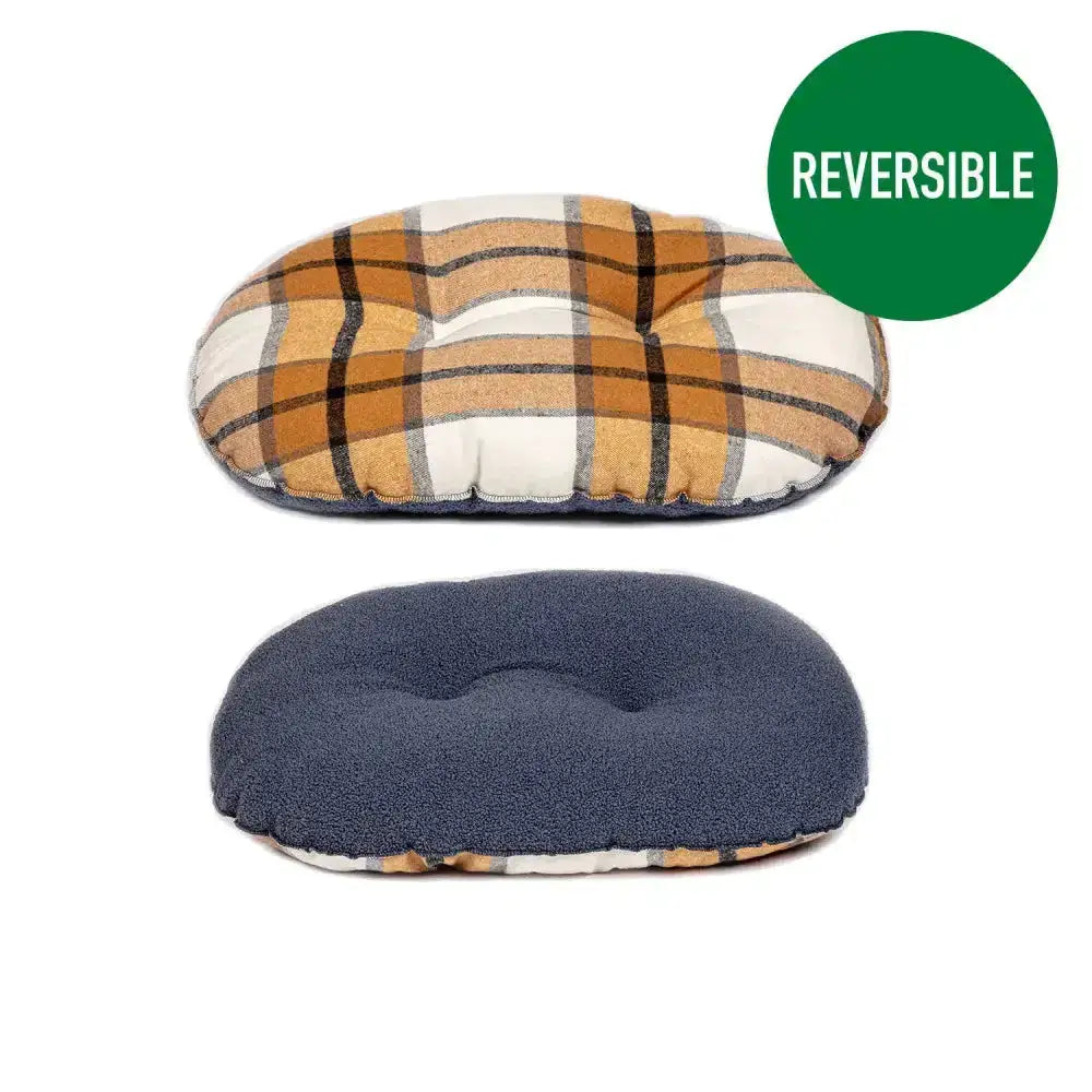 Reversible orthopedic pillow with plaid and navy fleece sides shown with danish design bowmore quilted mattress sand