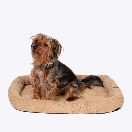 Beige plush dog bed from danish design essentials with soft sherpa texture and rounded edges essentials mattress beige