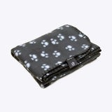 Black fleece essentials polar blanket with white paw print pattern and stitched edges from danish design essentials