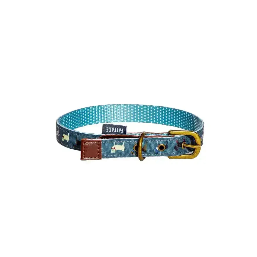 A teal danish design fatface marching dogs collar with white polka dots terrier prints brass buckle and brown leather tab