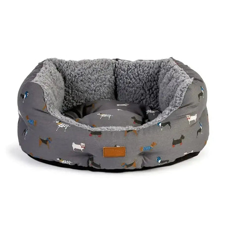 Gray dog bed with plush sherpa lining and colorful fatface marching dogs pattern in danish design fatface deluxe slumber bed