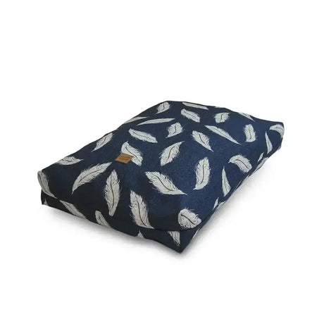 Navy blue dog bed with white feather pattern featuring danish design feather for cozy feather retreat duvet use