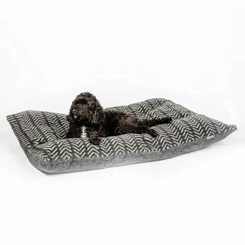 Gray and white herringbone dog bed with plush fabric shown with danish design fleece duvet cover charcoal arrows