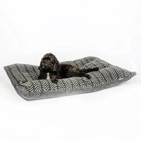 Gray and white herringbone dog bed with plush fabric shown with danish design fleece duvet cover charcoal arrows