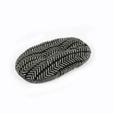 Black and white herringbone-patterned woolen slipper complementing danish design fleece quilted mattress charcoal arrows style