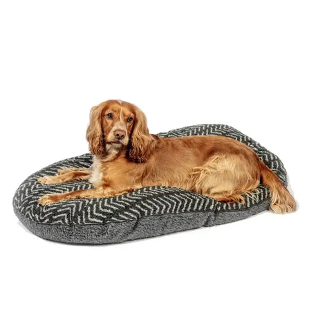 Gray and white herringbone dog bed with plush interior featuring danish design fleece quilted mattress charcoal arrows pattern