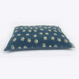 Dark blue rectangular pillow with light beige embroidered floral motifs on danish design harbour paw fleece deep duvet cover dog bed