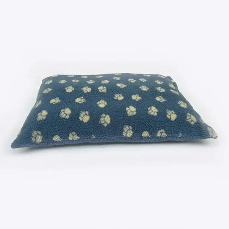 Dark blue rectangular pillow with light beige embroidered floral motifs on danish design harbour paw fleece deep duvet cover dog bed