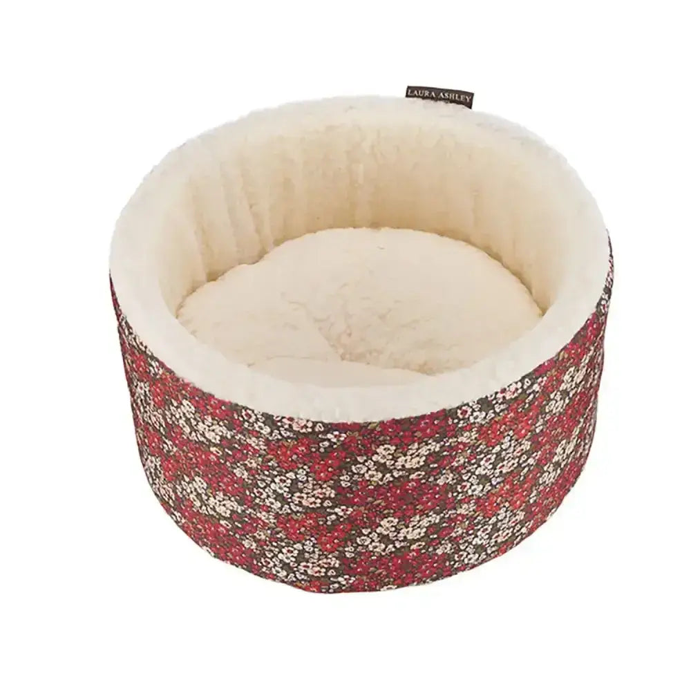Danish design laura ashley libby cat cosy bed with cream plush interior and floral fabric featuring red white blossoms