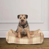 A cozy beige and red plaid dog bed with a soft cushioned interior from danish design newton snuggle bed line