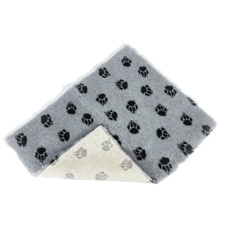 Gray plush danish design pet mat with paw print motif and non-slip white textured backing for pets