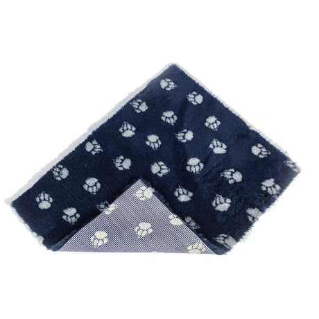 Navy blue danish design pet fleece navy blanket with white paw prints and non-slip backing striped underside
