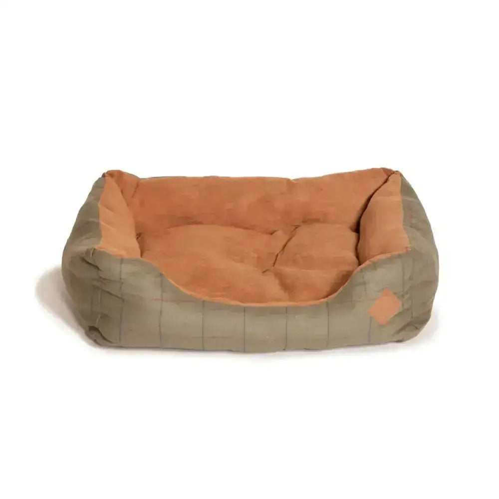 A cozy rectangular dog bed with soft tan interior and olive green quilted exterior danish design tweed snuggle bed