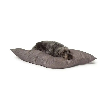 Gray textured danish design vintage dogstooth dog bed with a fluffy gray and black dog resting on a vintage deep duvet cushion