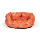 Orange cushioned dog bed with grey and white dachshund pattern from danish design woodland hare deluxe collection