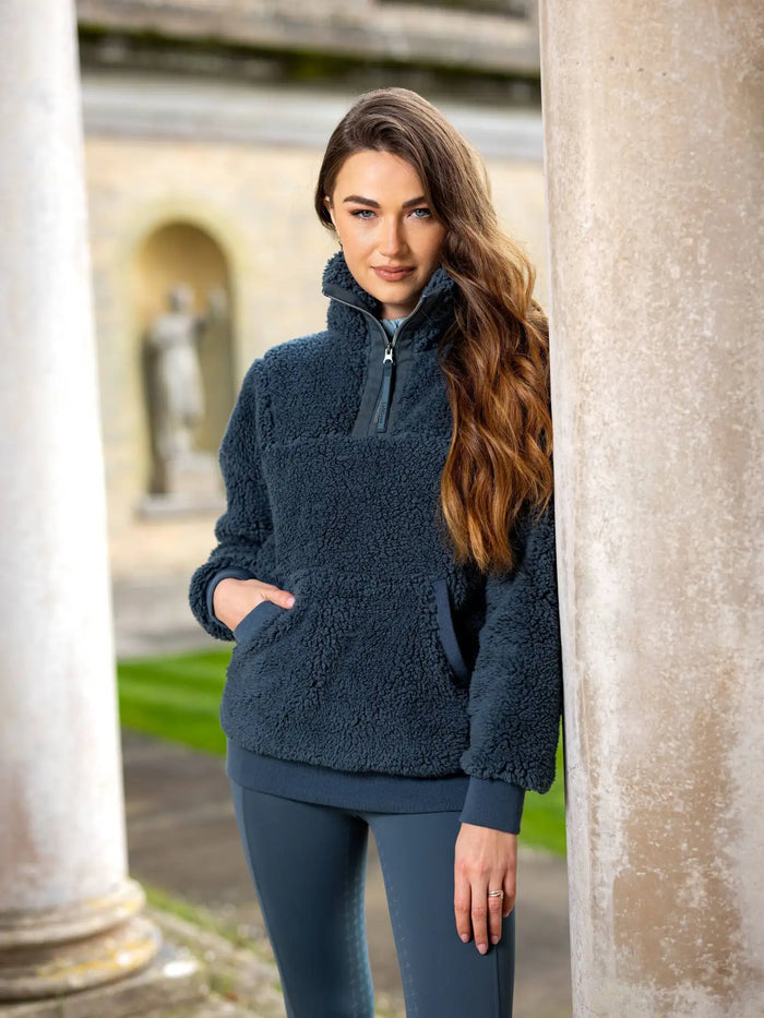 Dark blue fleece half-zip sweater with ribbed cuffs and hem