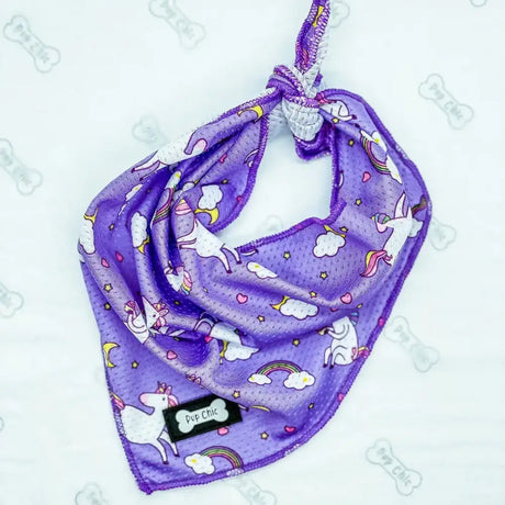 Purple unicorns cooling bandana with mesh texture and white pink rainbow accents for keeping cool