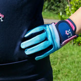 A vibrant turquoise and pink dazzling diamond riding glove with navy wrist strap and white lr logo by little rider