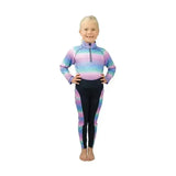A child wearing the dazzling night base funky base layer in purple pink and blue gradient with flexible fabric
