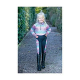 A child wears the dazzling night base funky base layer with rainbow stripes made of flexible fabric by little rider