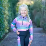 A child wearing a dazzling night base long-sleeved zip-up with funky base layer galaxy gradient and flexible fabric