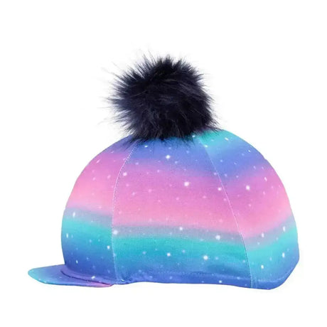 A dazzling night hat cover by little rider with a funky pastel galaxy ombre pattern and black pom pom topper