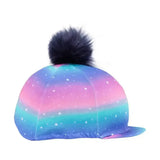 A dazzling night hat cover by little rider with a vibrant galaxy pattern and soft black faux fur pom-pom on top