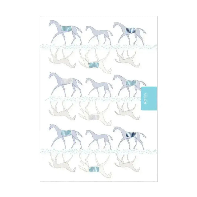 A white deckled edge notebook moody mare with a light gray and teal horse pattern pocket sized notebook