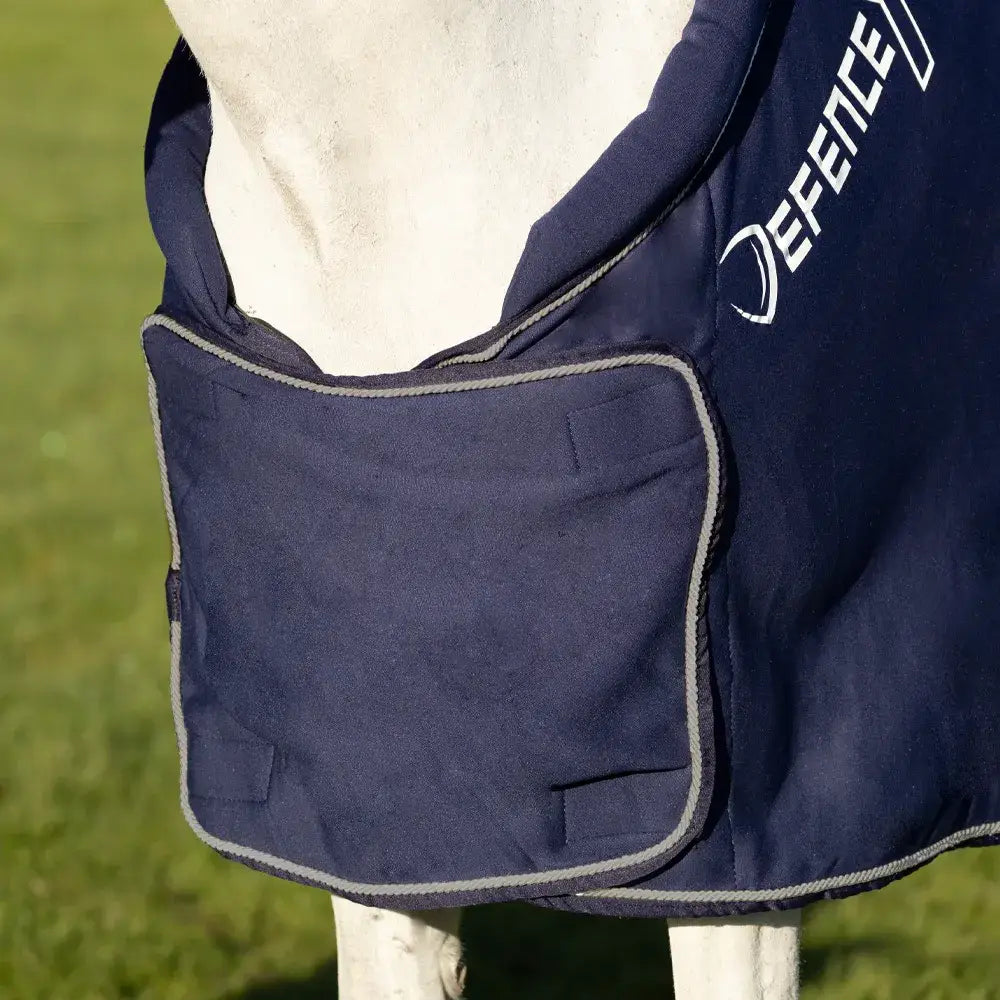 Navy blue DefenceX shield royal elite fleece rug with gray trim front pocket and white defence logo