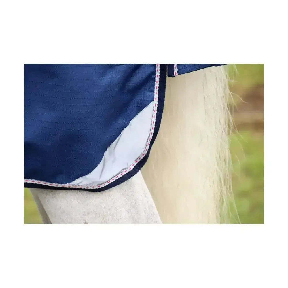 Navy blue defencex system 200 turnout rug with white lining detachable neck cover and durable denier material trim
