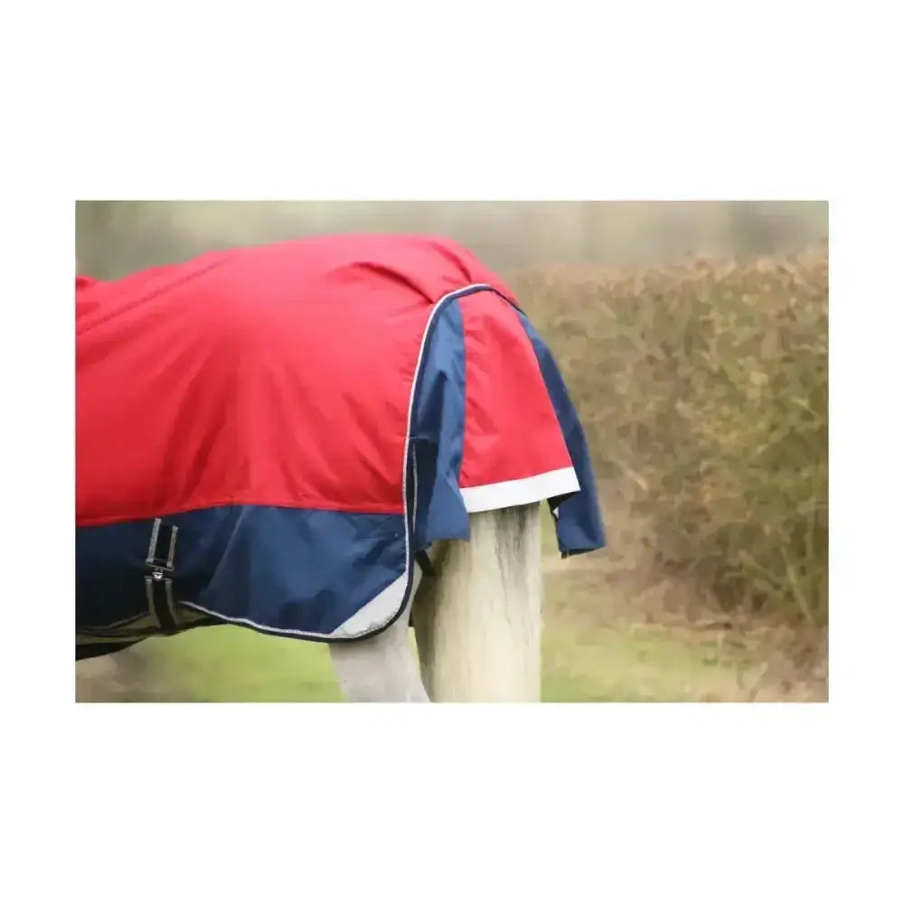 Defencex system 200 turnout rug in red and navy blue with white trim features detachable neck cover and durable denier material