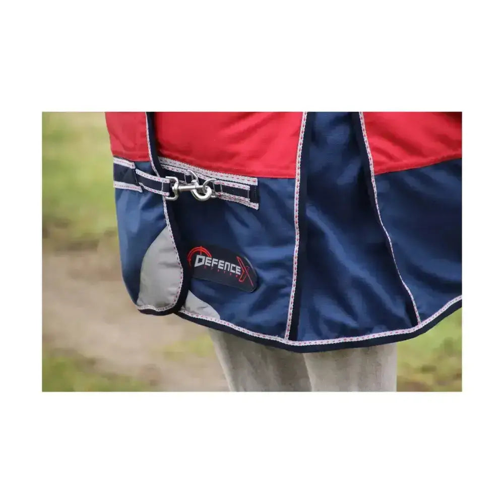Red and navy blue defencex system 200 turnout rug with detachable neck cover silver buckle and white stitching denier material