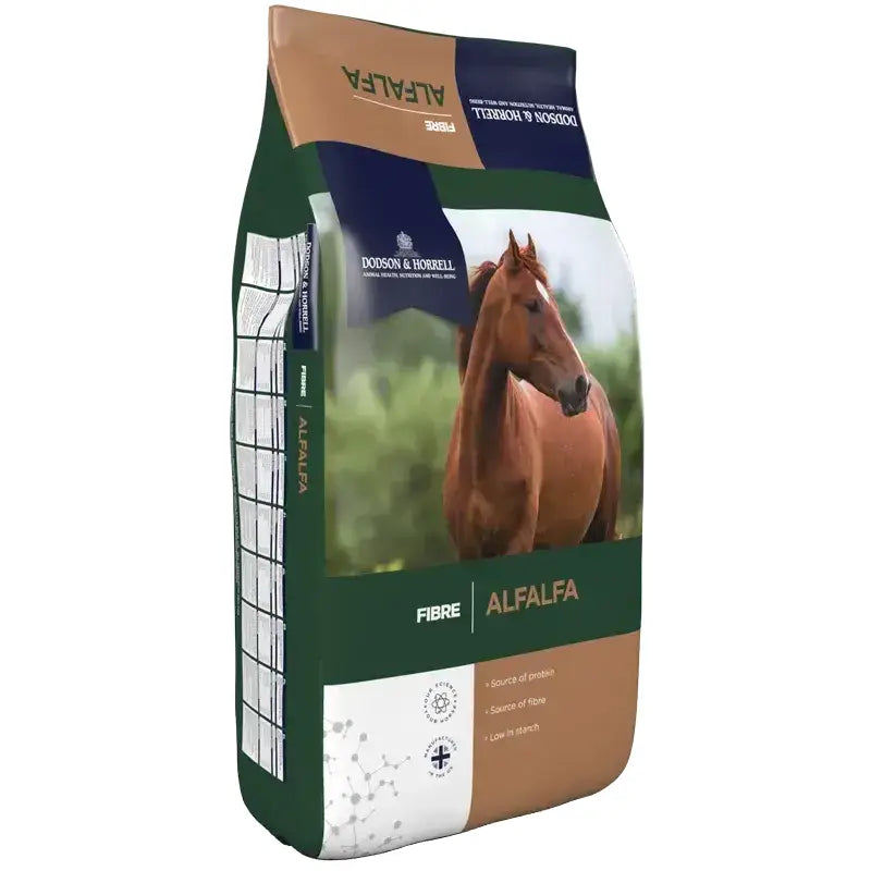 A brown horse on a green white and tan bag of dodson and horrell alfalfa chaff for horse feed
