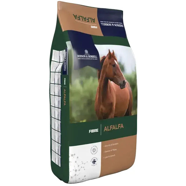 A brown horse on a green white and tan bag of dodson and horrell alfalfa chaff for horse feed